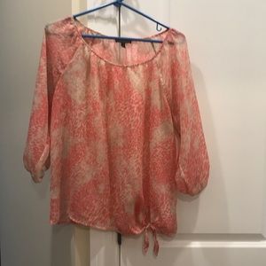 Women’s blouse. It’s a pink and cream color